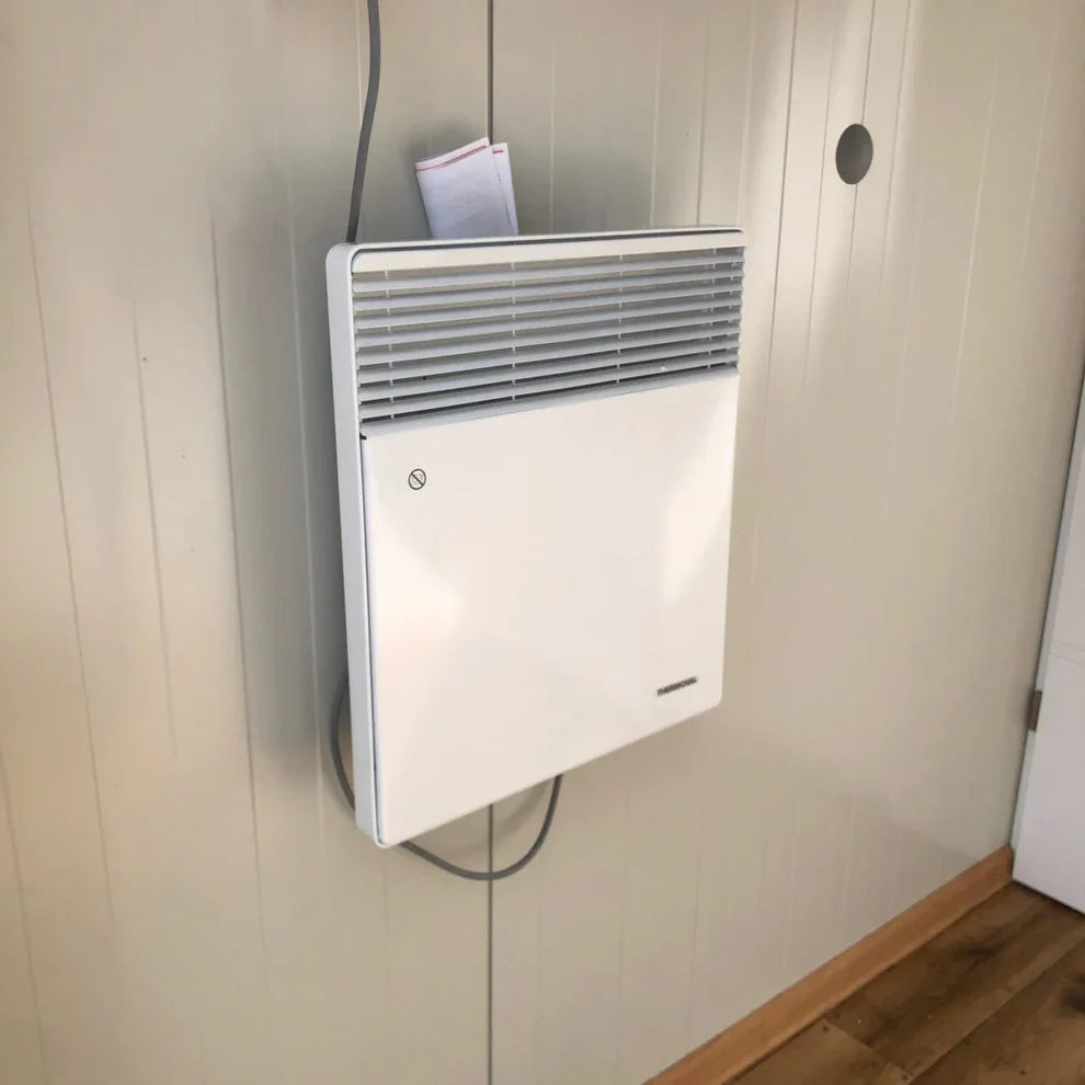 Conteneur sanitaire avec un revêtement extérieur imitation bois